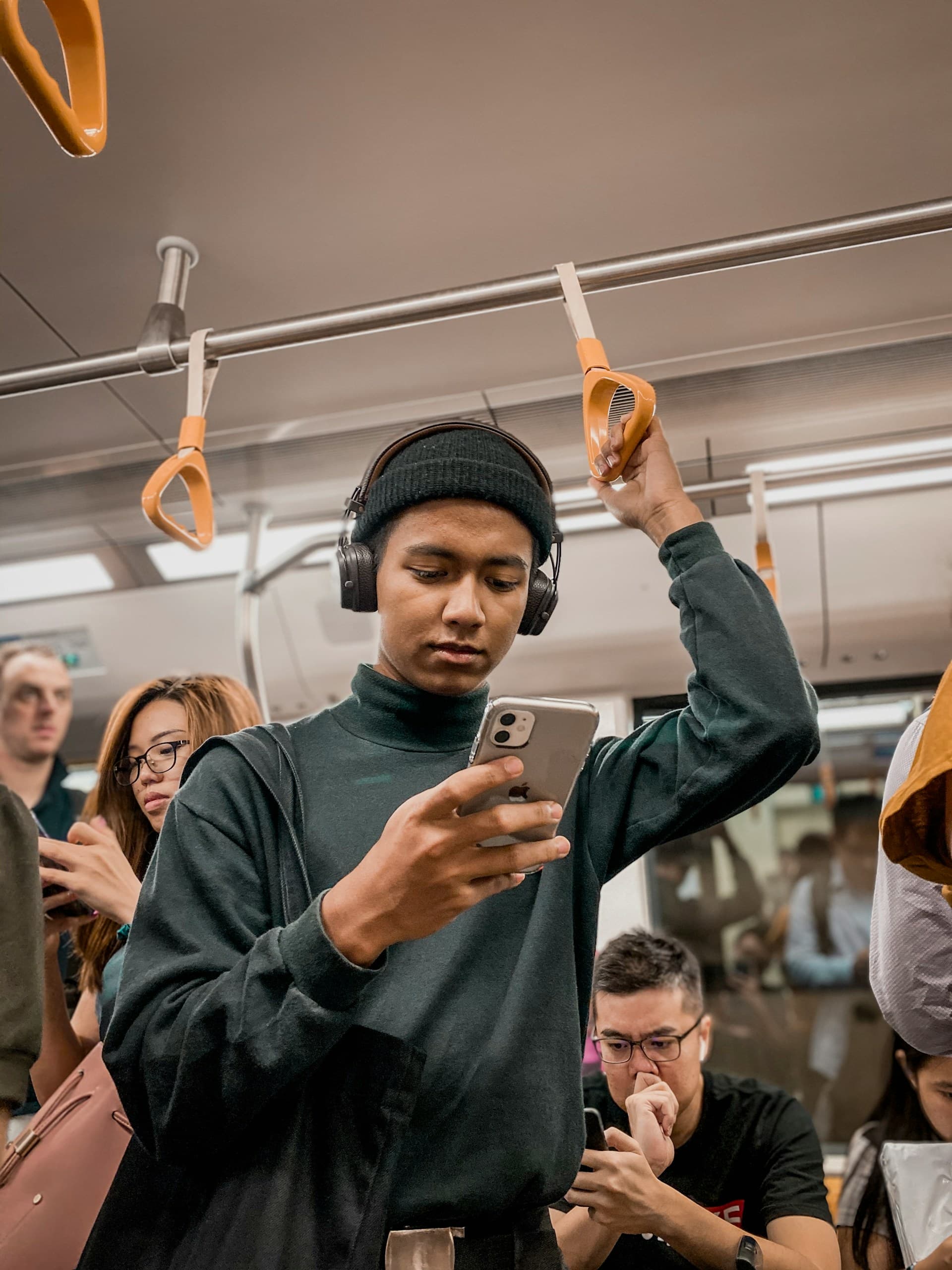 Passenger checking phone in a train